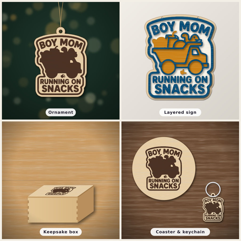 Laser cut wooden ornament engraved with the words Boy Mom Running On Snacks around a brown loaded truck silhouette, hanging on a thin cord against a blurred dark green background.