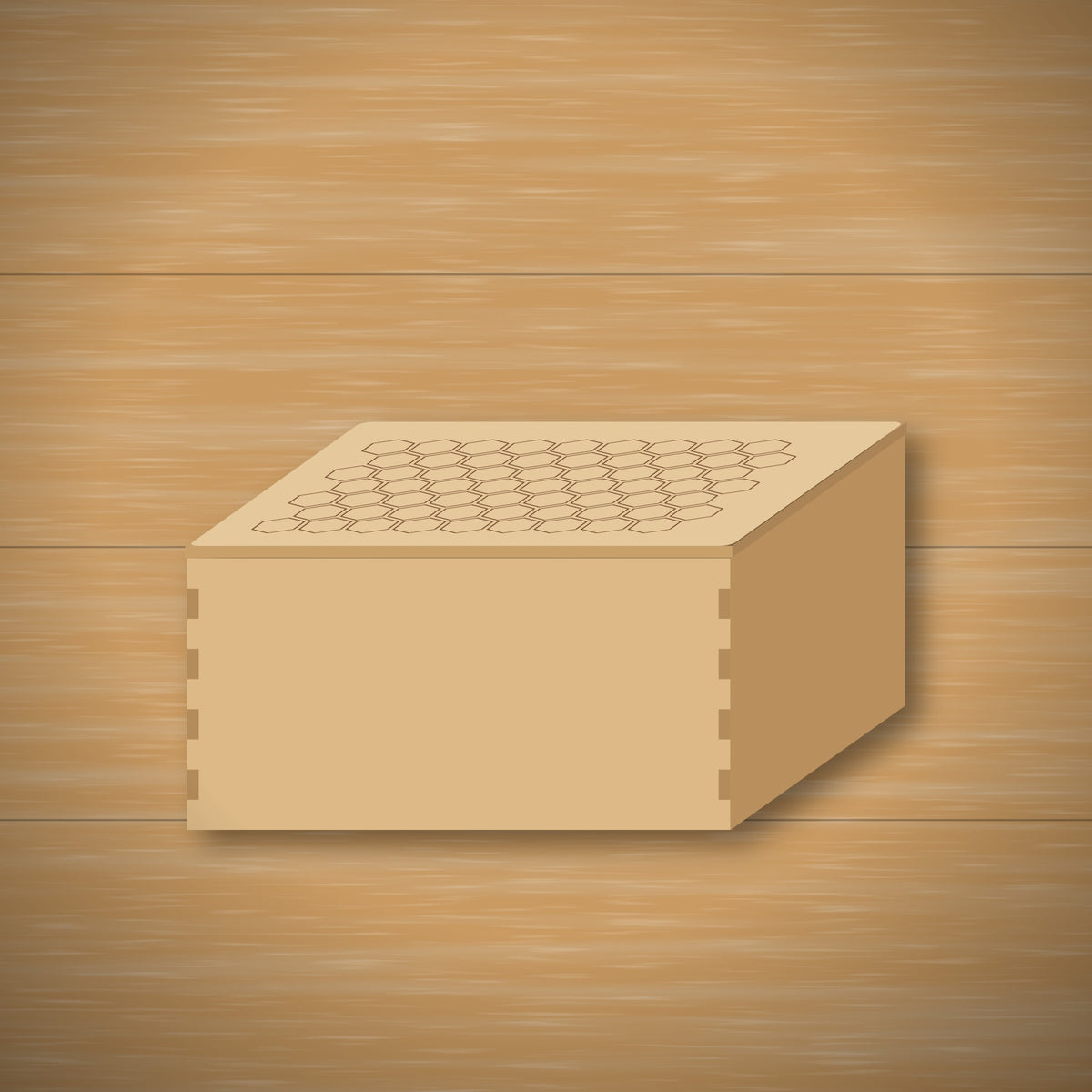 Finished light wood keepsake box with finger-jointed corners and a lid engraved with a honeycomb pattern, sitting on a wooden table.