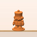 A chunky orange 3D printed nutcracker soldier figurine with a tall hat, round mustache, curly side hair, buttons and a round display base.