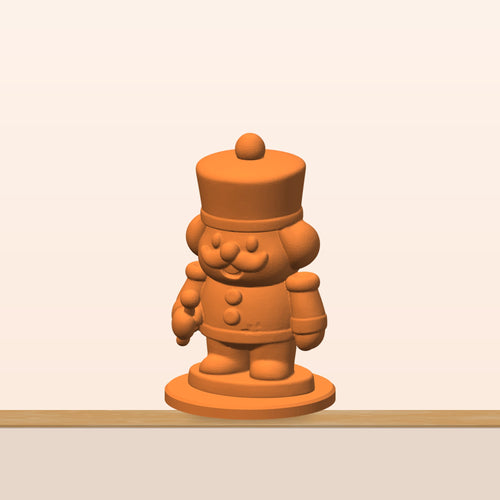 A chunky orange 3D printed nutcracker soldier figurine with a tall hat, round mustache, curly side hair, buttons and a round display base.