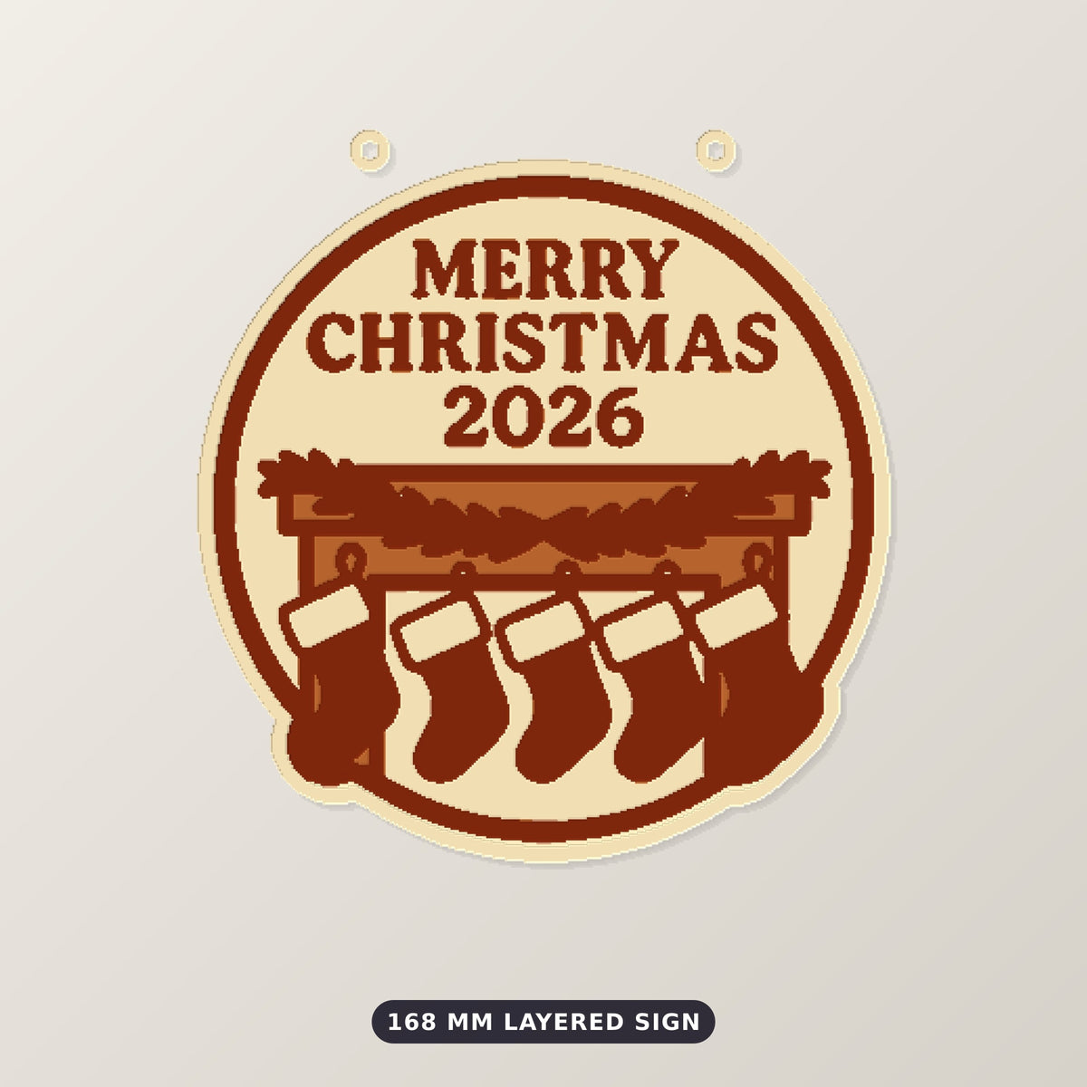 Round cream and brown Merry Christmas 2026 ornament showing five red stockings hanging from a mantel with a green garland, on a blurred dark green background with golden lights.