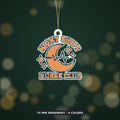 A retro orange and teal crescent moon ornament with a heartbeat line and stars, with the text Night Shift Nurse Club, hanging on a gold string against a dark green background.