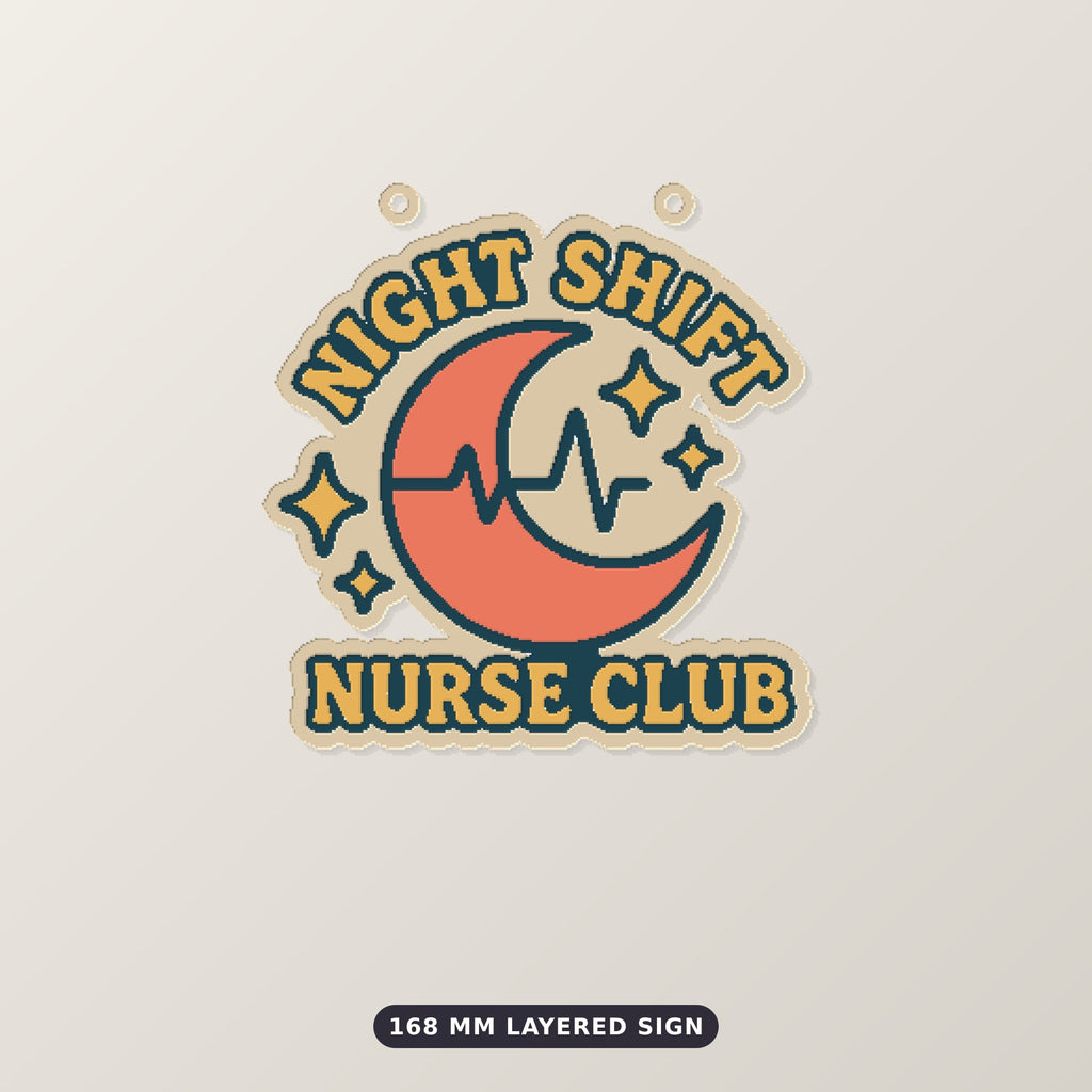 A retro orange and teal crescent moon ornament with a heartbeat line and stars, with the text Night Shift Nurse Club, hanging on a gold string against a dark green background.