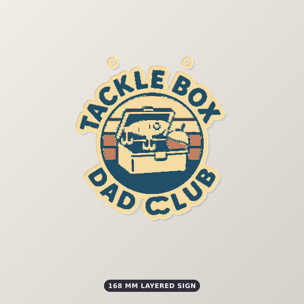 Round retro ornament showing an open tackle box on a striped sunset circle with the words Tackle Box Dad Club around the edge, hanging against a dark green background with golden bokeh lights.