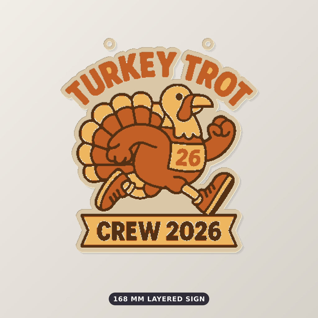 A cartoon turkey in running shoes and a number 26 race bib on a round ornament that reads Turkey Trot at the top and Crew 2026 on a ribbon banner below.