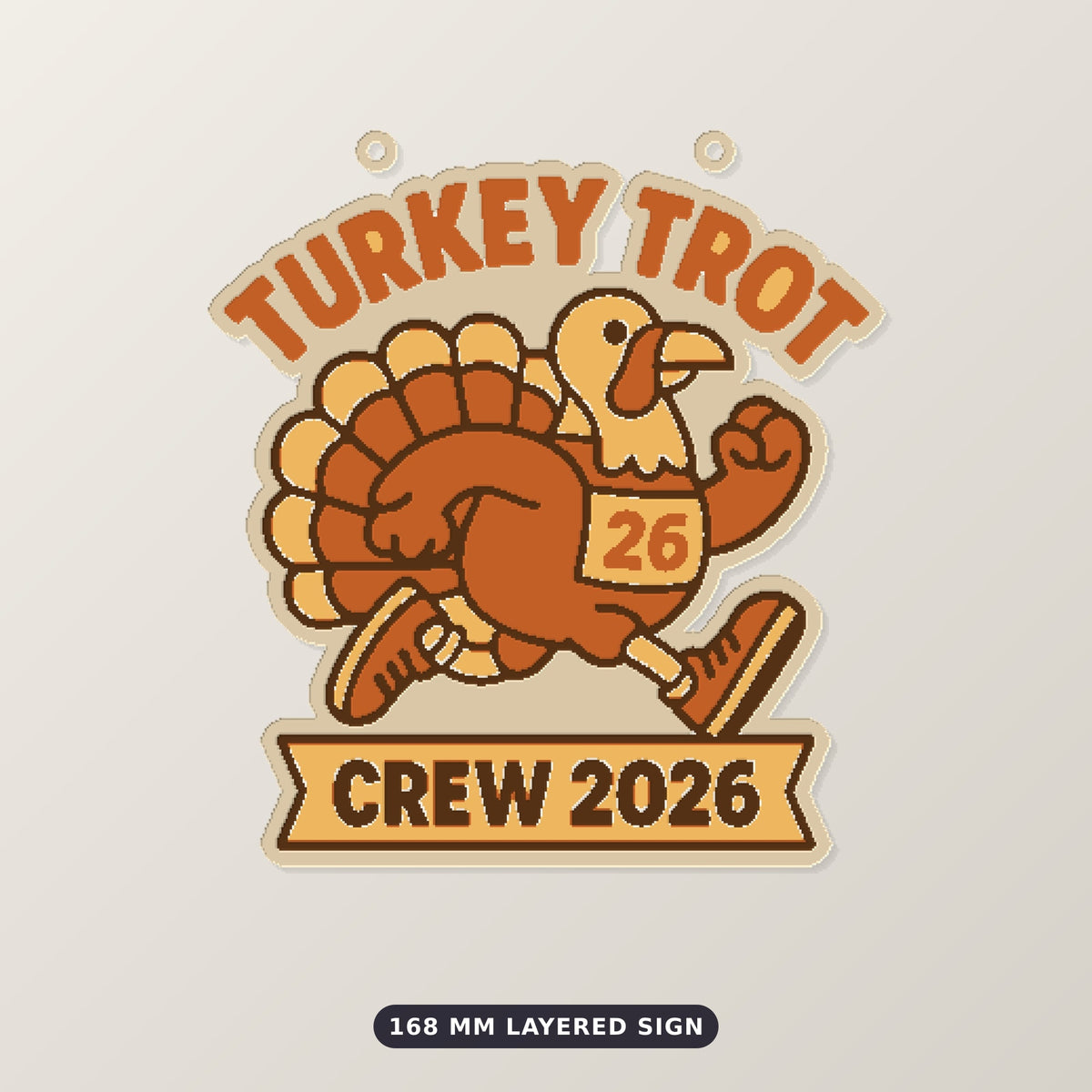 A cartoon turkey in running shoes and a number 26 race bib on a round ornament that reads Turkey Trot at the top and Crew 2026 on a ribbon banner below.
