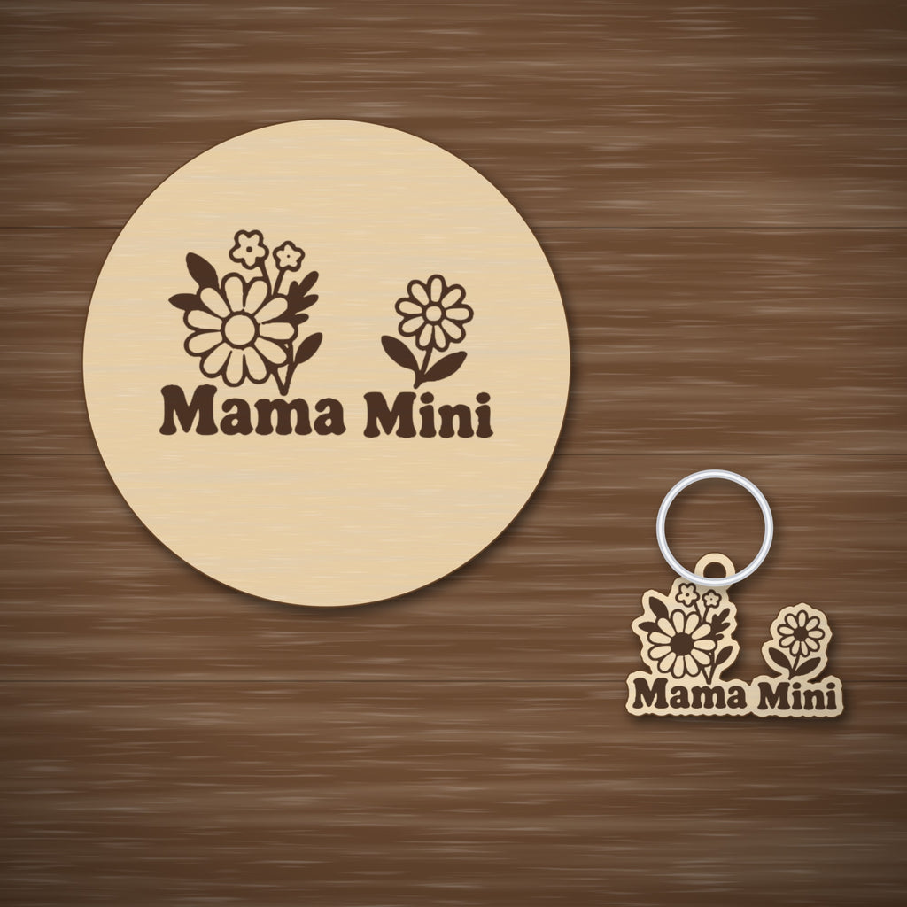 Wooden laser cut ornament with engraved daisy bouquet and single daisy, reading Mama Mini, hanging by a thin cord against a dark green background with golden bokeh lights.